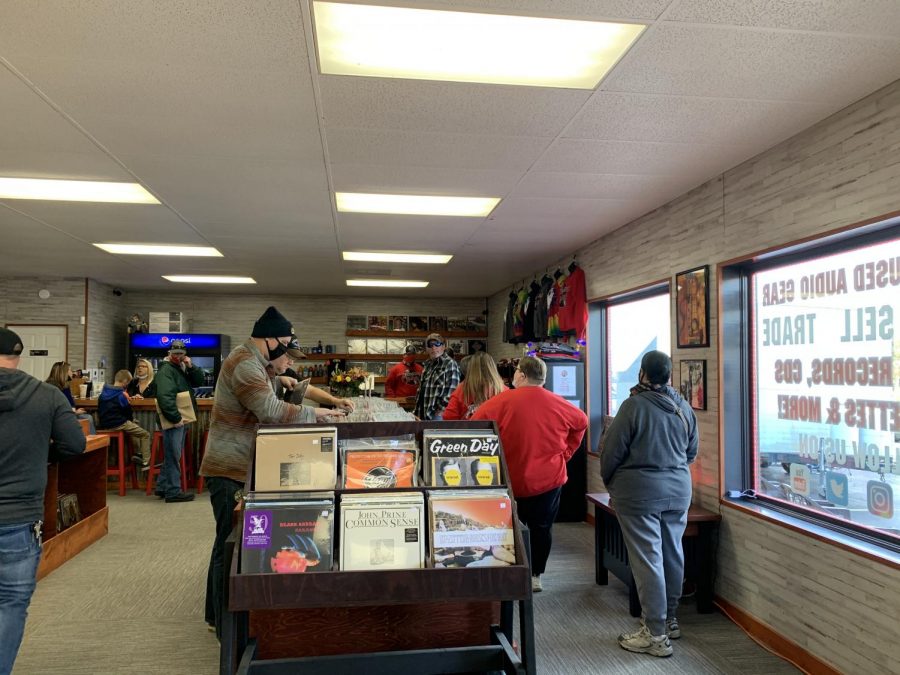Customers browse the selection of records, and wait to make their purchases,  at the stores grand opening on Oct. 24, 2020.