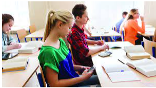 Girl in class distracted by social media