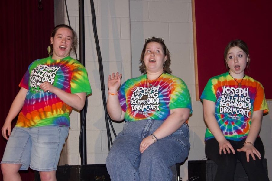 Narrators Madison Ingram, Olivia Buck, and Mackenzie Jones narrating the show through singing. 

Photo Courtesy of Sophie Doering