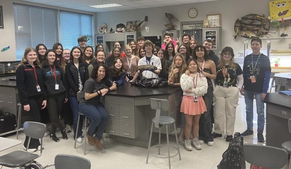 Members of Biology Club pose with a preserved groundhog on Groundhogs Day in Laakers classroom.