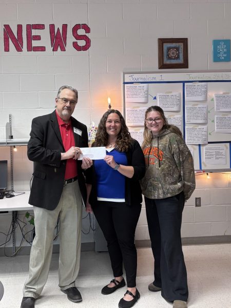 Former publisher of The Telegraph, Jim Shrader presents a check to journalism adviser, April Gray, and Redbird Word Editor in Chief, Leigha Cole.
Photo by Lydia Copeland, Social Media Manager