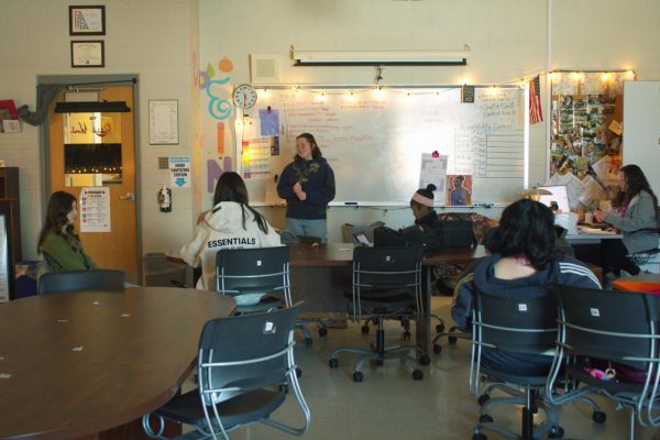 Editor-in-Chief Leigha Cole and the journalism staff discussing ideas for the upcoming issue of the Redbird Word.